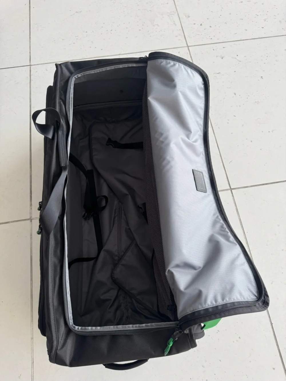 TUMI Tall Black Rolling Duffel Check on Alpha Suitcase Luggage Bag Green Accents